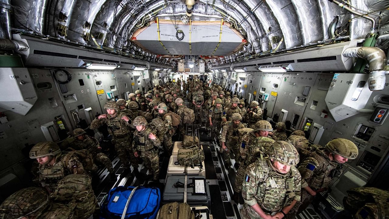 Members of the British Army, from 16 Air Assault Brigade, as they disembark from an RAF Voyager aircraft after landing in Kabul, Afghanistan, to assist in evacuating British nationals and entitled persons as part of Operation PITTING. Credit: AFP Photo
