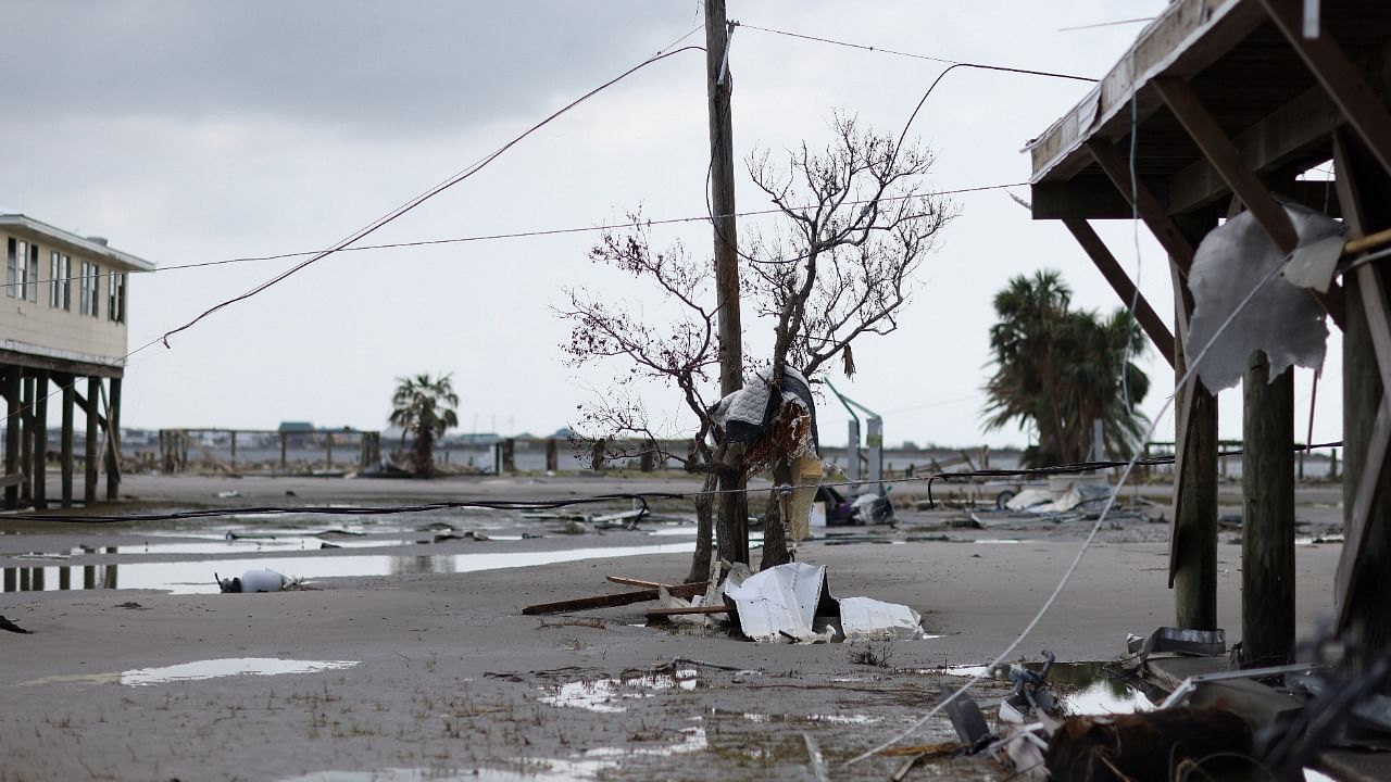 Debris can be seen caught in a tree among damaged and destroyed homes days after hurricane Ida ripped through Grand Isle, Louisiana. Credit: Reuters Photo