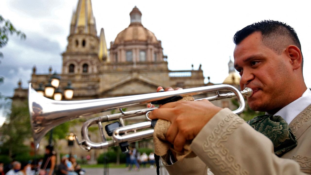 A Mexican Mariachi musician performs a serenade at the beginning of the 28th International Mariachi Meeting as part of the Open-Air National Festivities in Guadalajara. Credit: AFP Photo