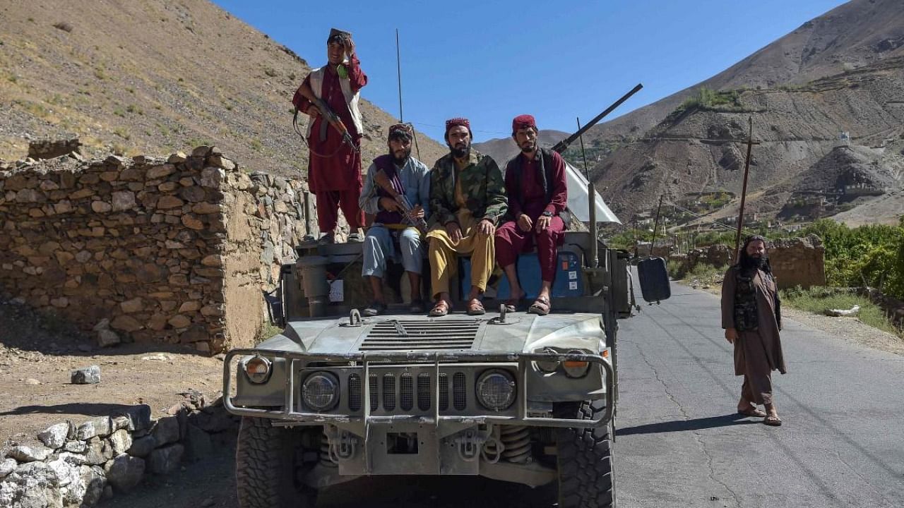 Taliban fighters sit atop a Humvee in Omarz area, Panjshir Province on September 15, 2021, days after the hardline Islamist group announced the capture of the last province resisting to their rule. Credit: AFP Photo