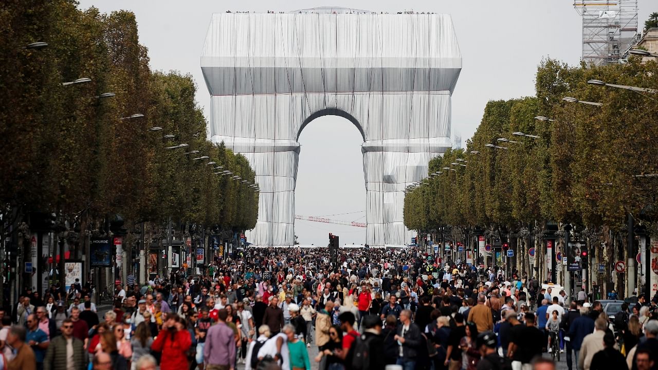 Paris' Arc de Triomphe covered in shimmering fabric in a tribute to artist Christo Credit: Reuters Photo