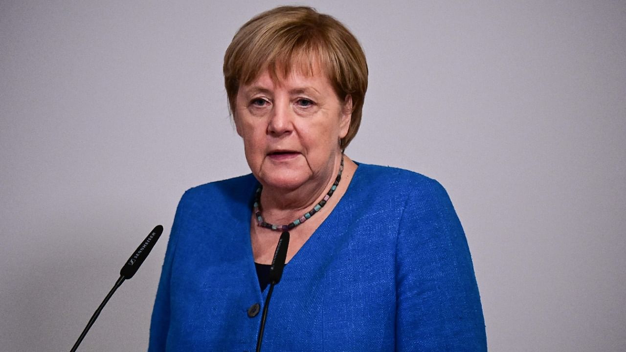 Merkel in photos: From football fan to Trump tamer
