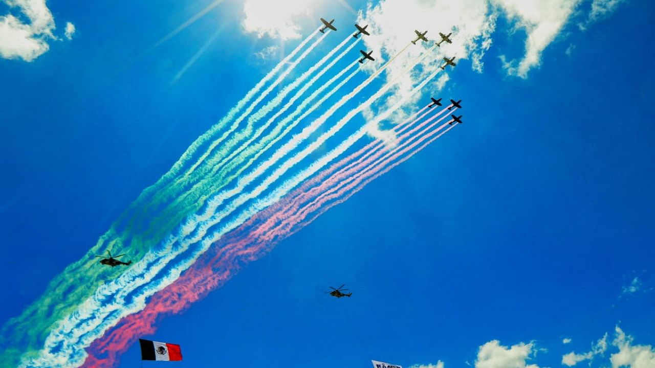 Pilatus PC-7 aircrafts fly in formation during the air show as part of the Aerospace Fair 2021 at Santa Lucia military air base in Zumpango, near Mexico City. Credit: Reuters photo