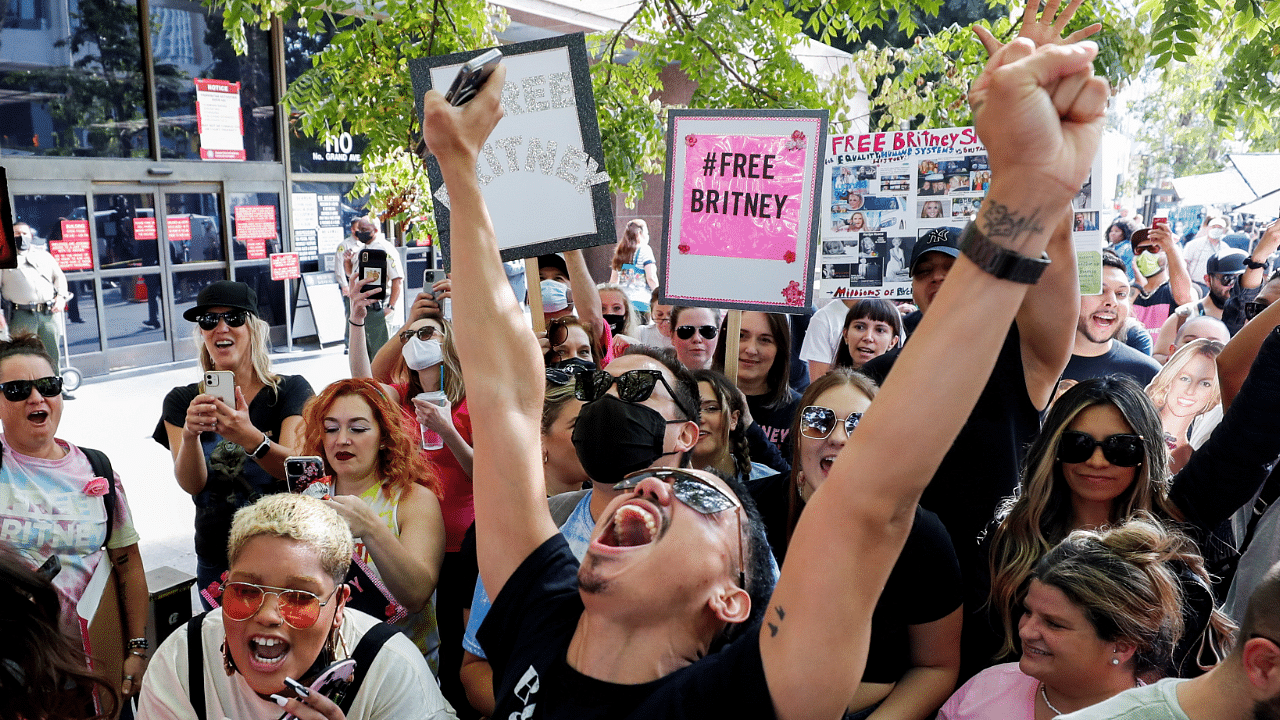 Britney Spears conservatorship case returns to court, in Los Angeles. Supporters of the pop star celebrate after a judge suspended her father from his 13-years-long role as the controller of the singer's business affairs at Stanley Mosk Courthouse in Los Angeles, California. Credit: Reuters Photo
