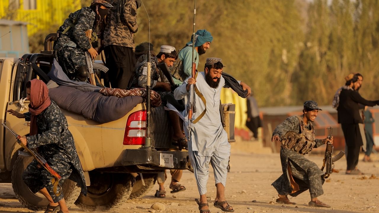 Taliban fighters enjoy a day off at Kabul's amusement park; see pics