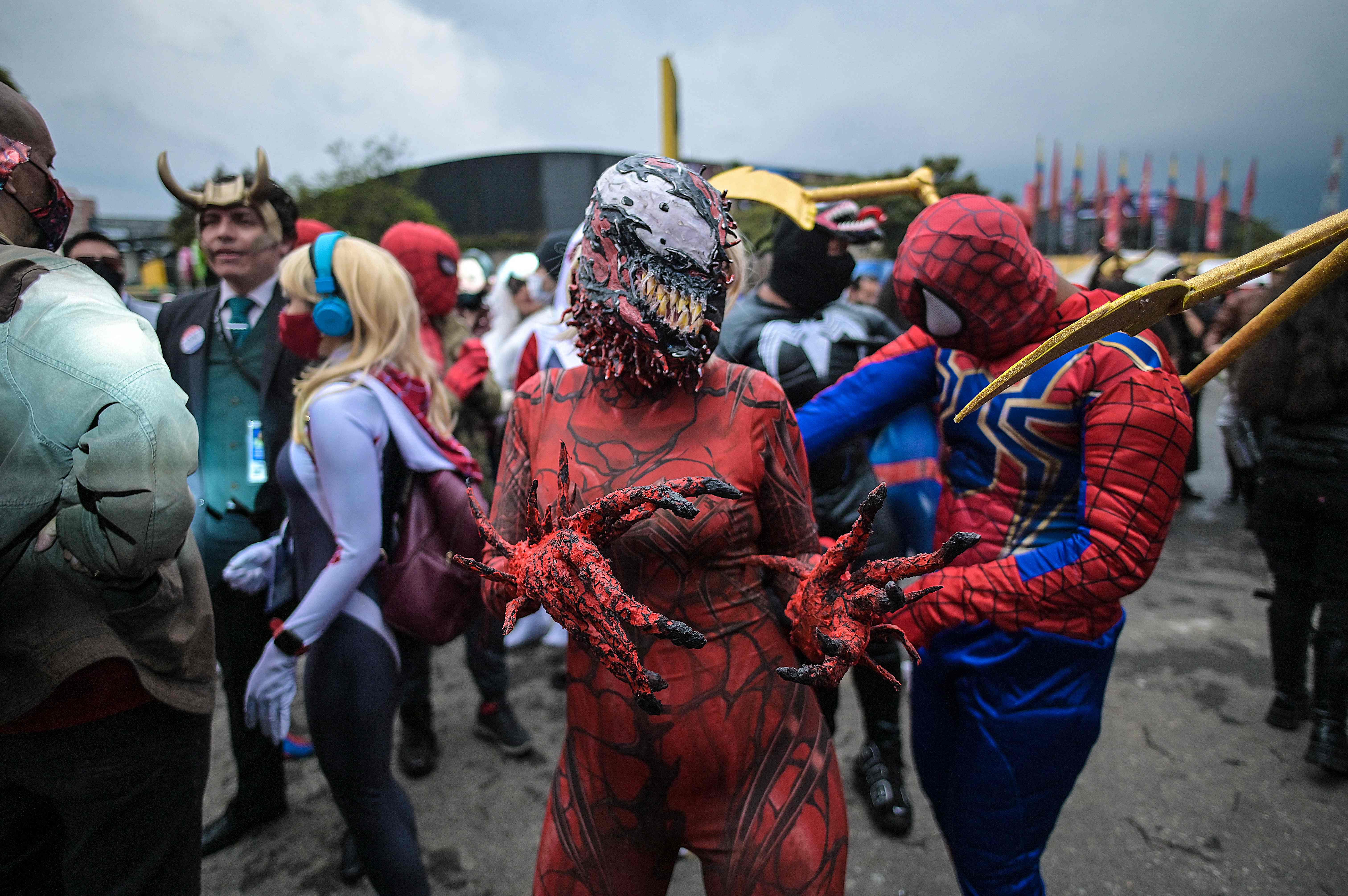 People disguised as superheroes dance during a festival of Marvel comics in Bogota. Credit: AFP Photo