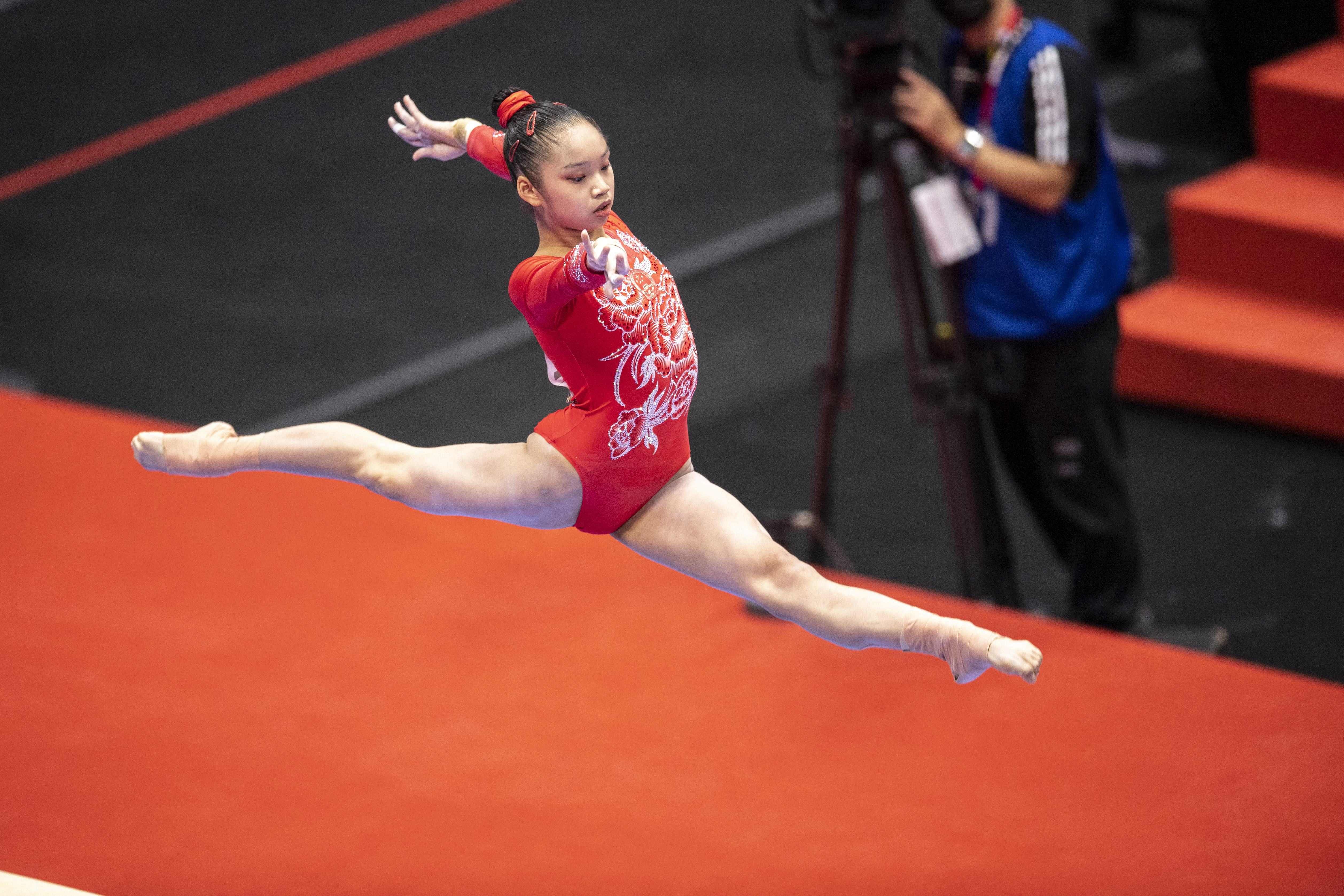 China's Luo Rui competes in the balance beam event at the women’s team qualification during the Artistic Gymnastics World Championships at the Kitakyushu City Gymnasium in Kitakyushu. Credit: AFP Photo