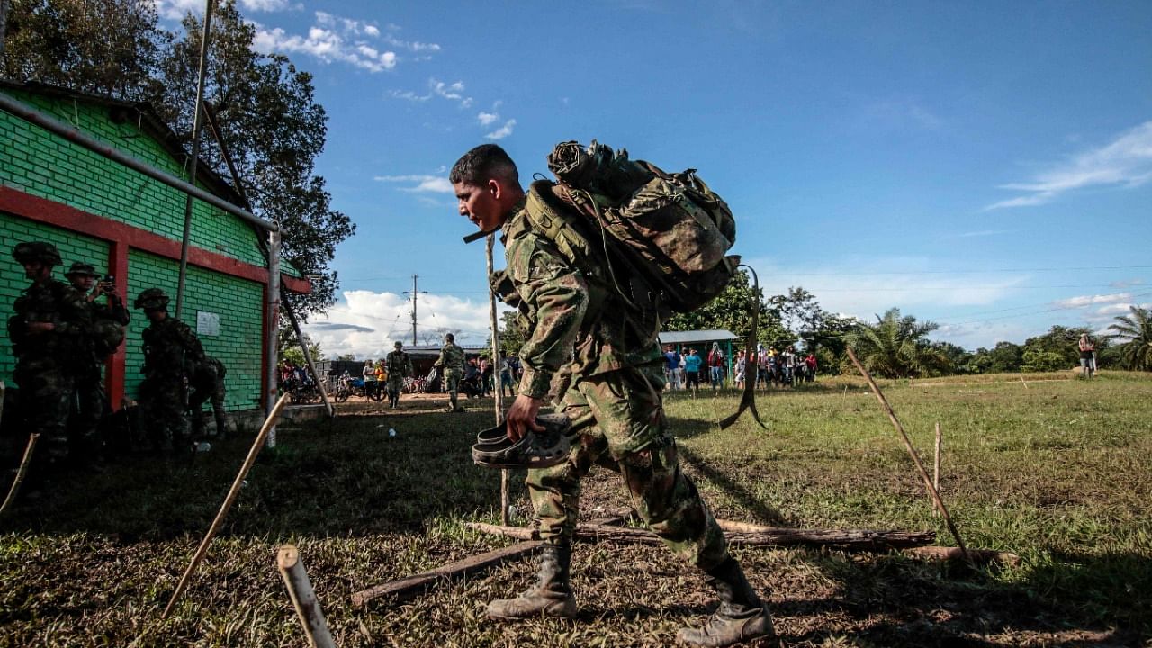 A Colombian soldier walks after being released by peasants in the municipality of Tibu, Norte de Santander department, Colombia, on the border with Venezuela. Credit: AFP Photo