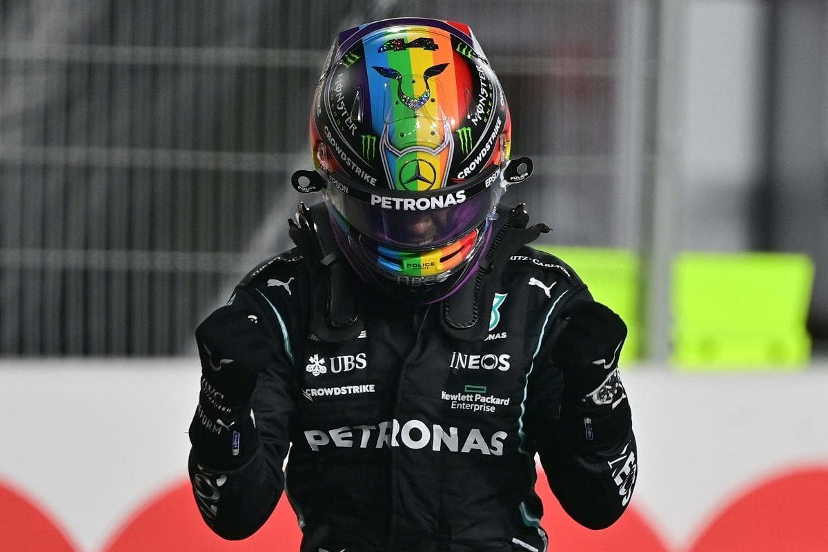  Mercedes' British driver Lewis Hamilton celebrates after the qualifying session ahead of the Qatari Formula One Grand Prix at the Losail International Circuit, on the outskirts of the capital city of Doha. Credit: AFP Photo