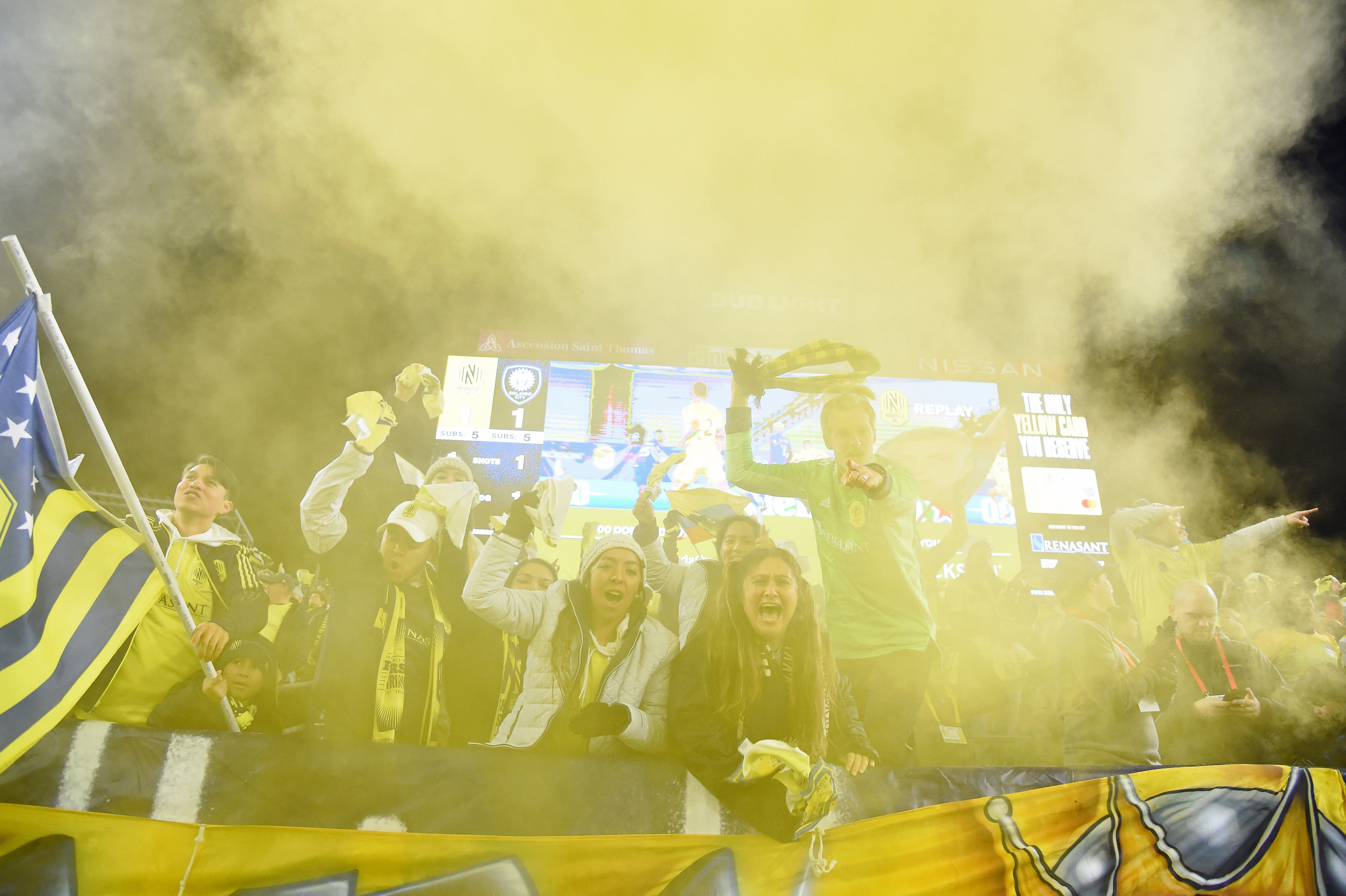 Nashville SC fans celebrate a goal against Orlando City by midfielder Hany Mukhtar (not pictured) during the first half of a round one MLS Playoff game at Nissan Stadium. Credit: USA Today Sports