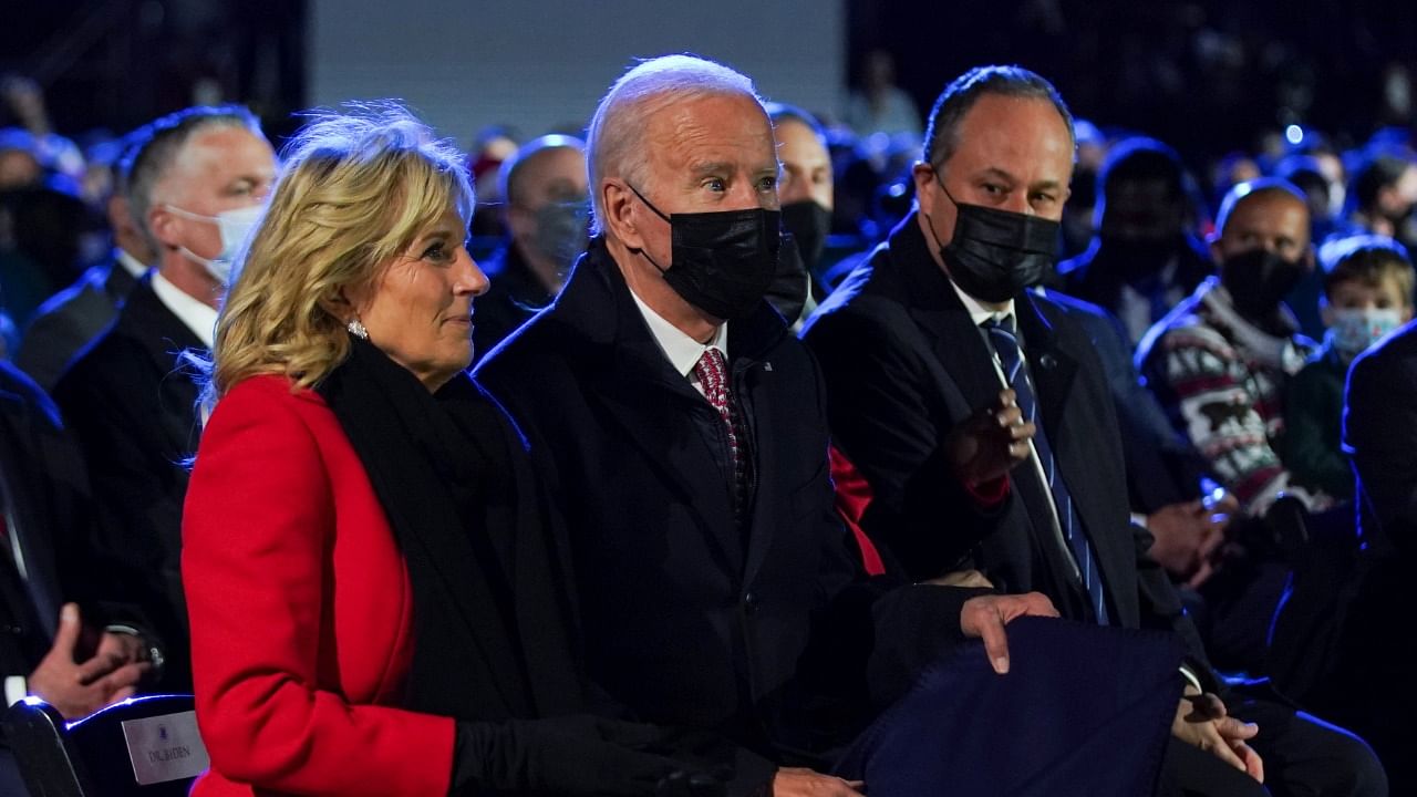 Second gentleman Doug Emhoff looks over at US President Joe Biden and first lady Jill Biden during the National Christmas Tree Lighting ceremony in Washington, US. Credit: Reuters Photo