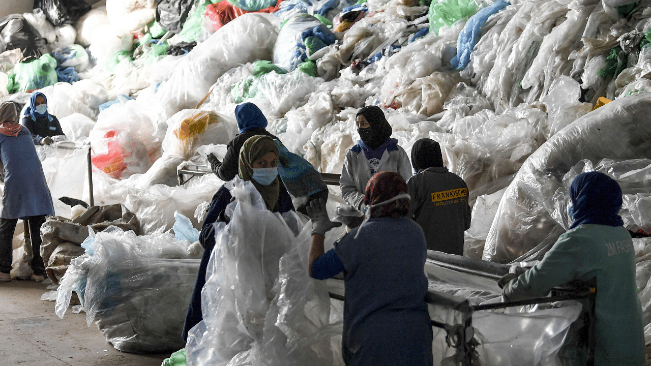 Employees of AFREC African Recycling, sort out piles of plastic waste at the recycling facility in the industrial zone of Mghira, near the Tunisian capital Tunis. Credit: AFP Photo