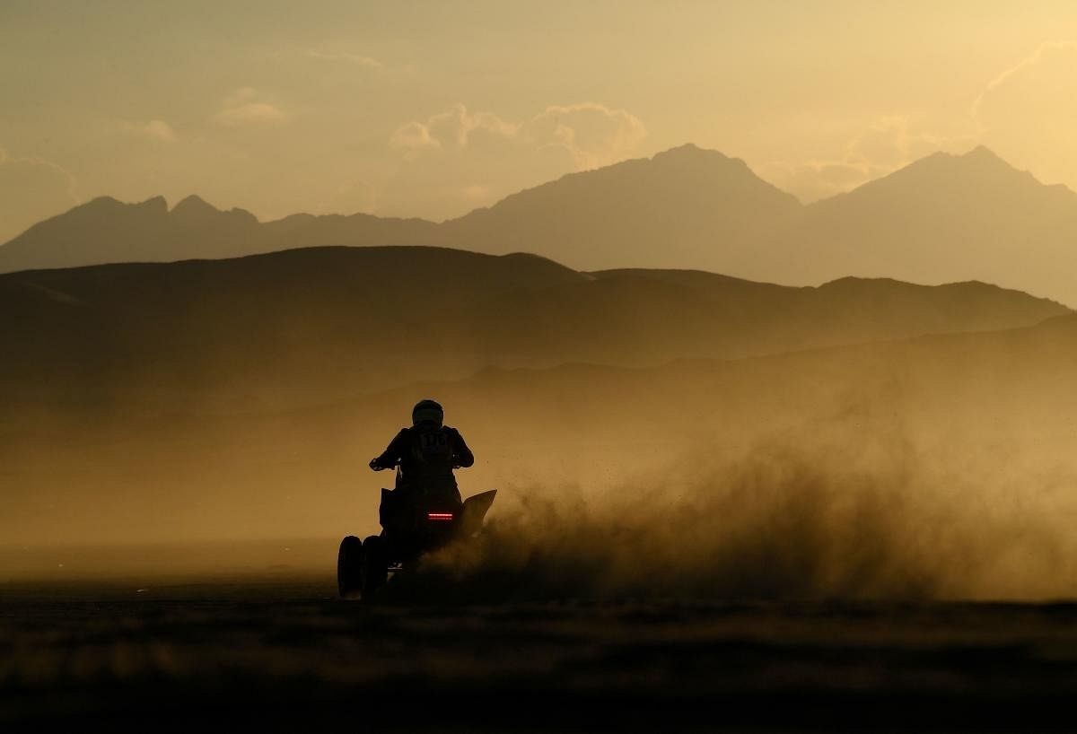 A biker competes during the Stage 1A of the Dakar Rally 2022 between Jeddah and Hail, in Saudi Arabia. Credit: AFP Photo