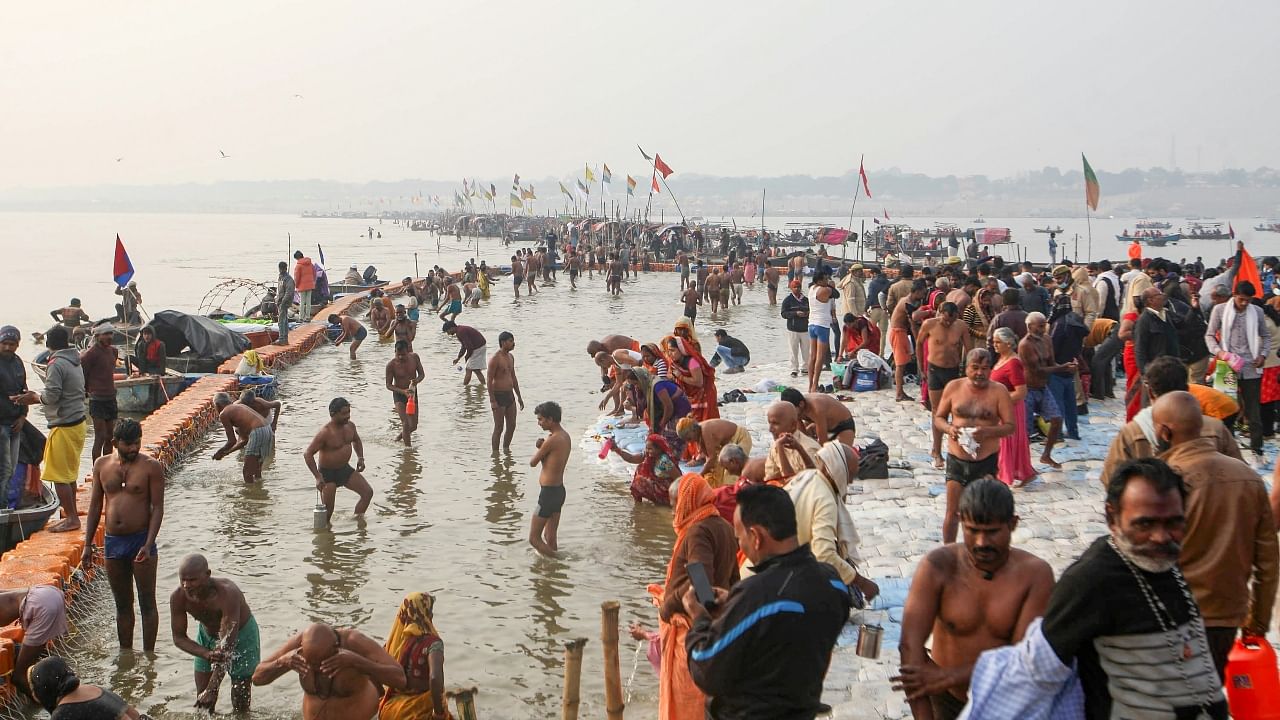 Throwing caution to the wind, thousands take holy dip on Makar Sankranti