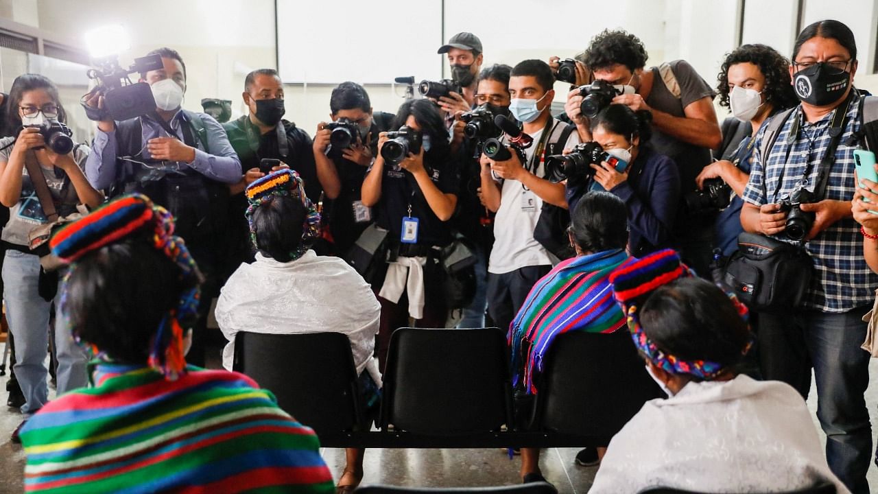 Members of the media photograph women attending the trial of five former Guatemalan paramilitaries charged with the rape of 36 women from the indigenous Achi group from 1981 to 1985 during the Central American country's decades-long civil war, at the Supreme Court building in Guatemala City, Guatemala. Credit: Reuters Photo