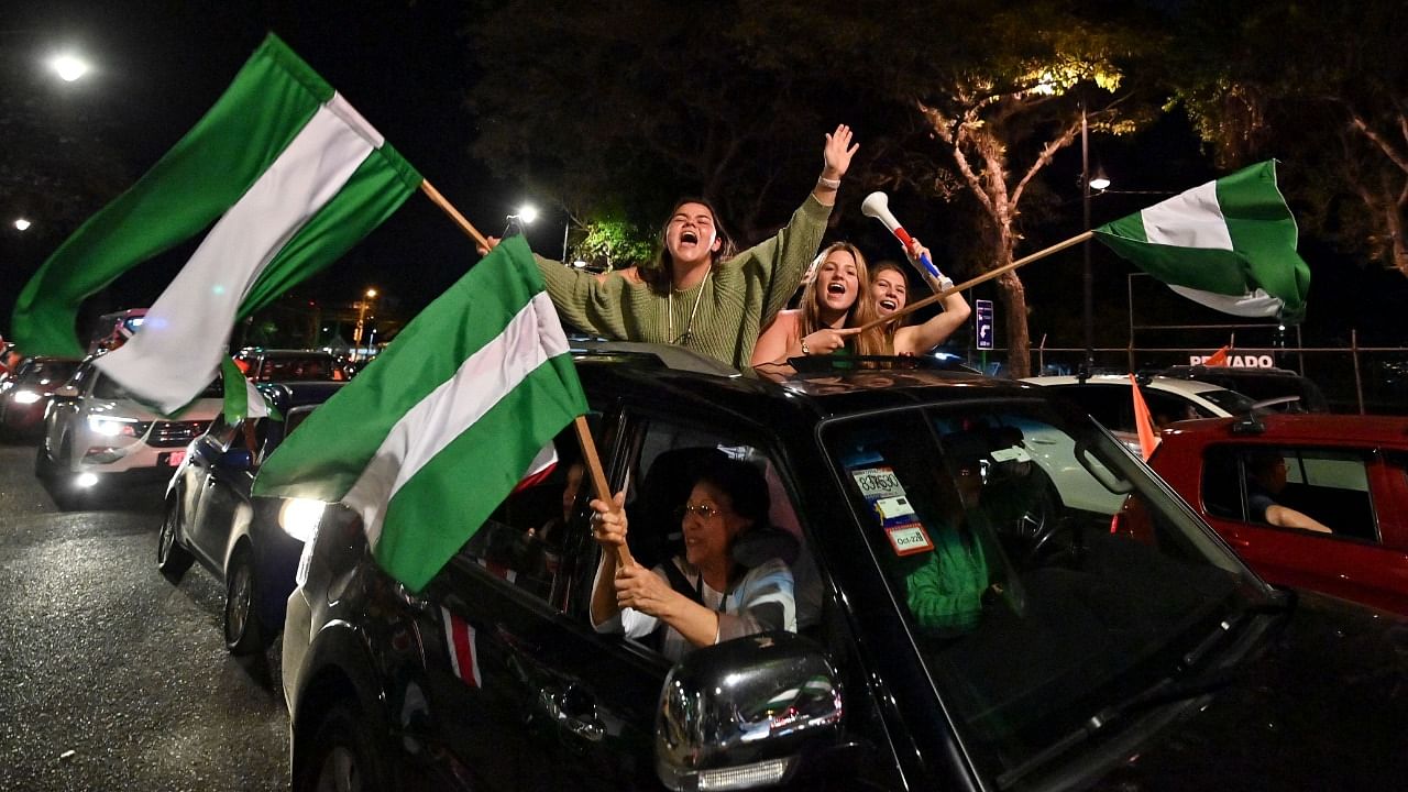 Supporters of presidential candidate Jose Maria Figueres of the National Liberation Party (PLN) are seen outside the Figueres' campaign headquarters in San Jose, Costa Rica. Credit: AFP Photo