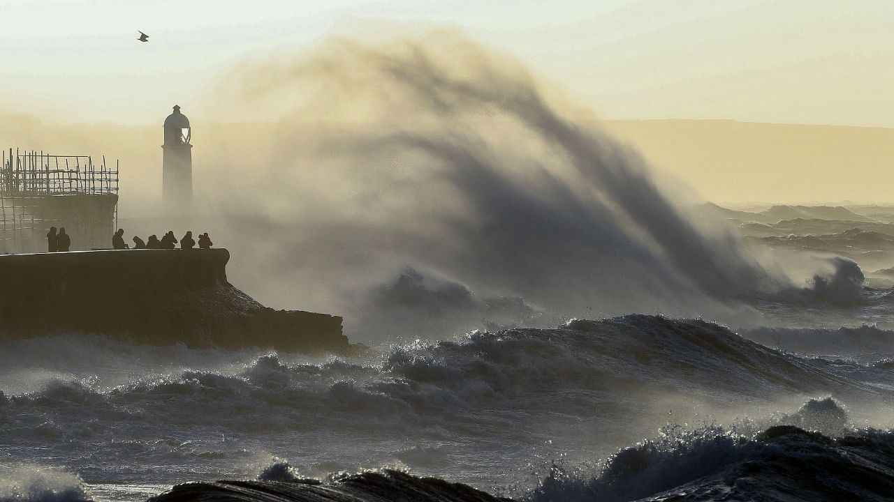 Waves crash against the sea wall at Porthcawl, south Wales, on February 18, 2022 as Storm Eunice brings high winds across the country. Credit: AFP Photo