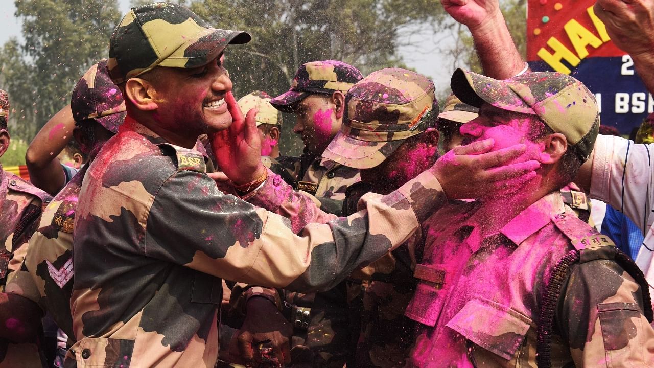 BSF Jawans celebrate Holi with great zeal; See Pics Credit: AFP Photo