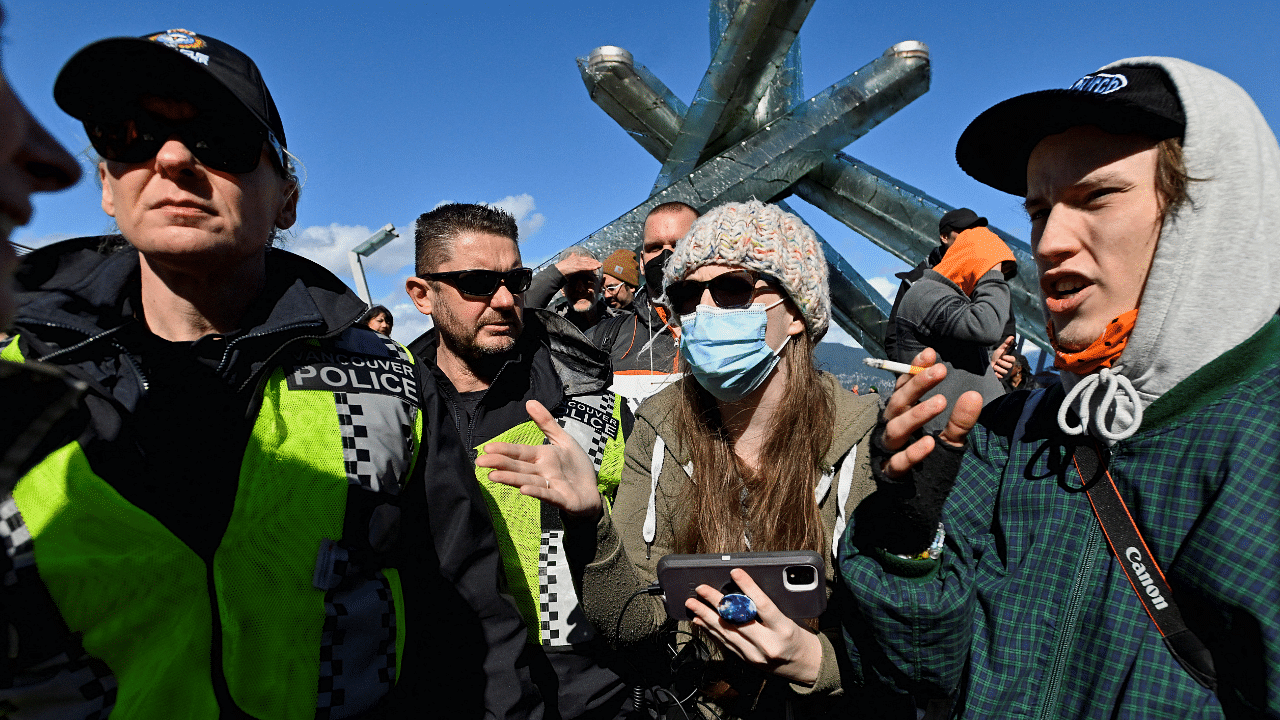 Counter protesters are confronted at a rally held by opponents of the coronavirus disease (COVID-19) vaccine and mask mandates, in downtown Vancouver, British Columbia, Canada. Credit: Reuters Photo