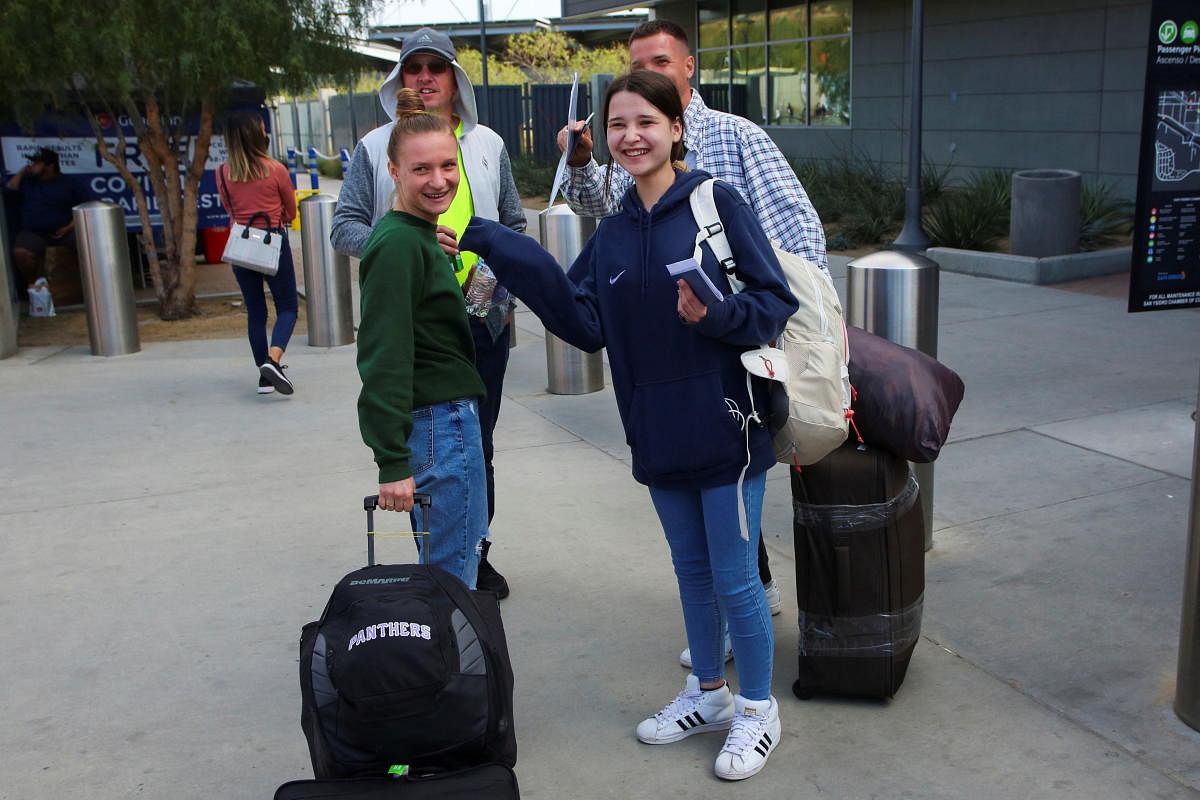 Ukrainians fleeing Russia's invasion cross from Mexico into the United States, in San Diego. Credit: Reuters Photo