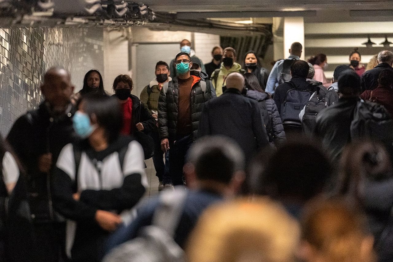 Commuters walk through Times Square station, after a shooting at a subway station in Brooklyn borough, in Manhattan, New York City. Credit: Reuters Photo