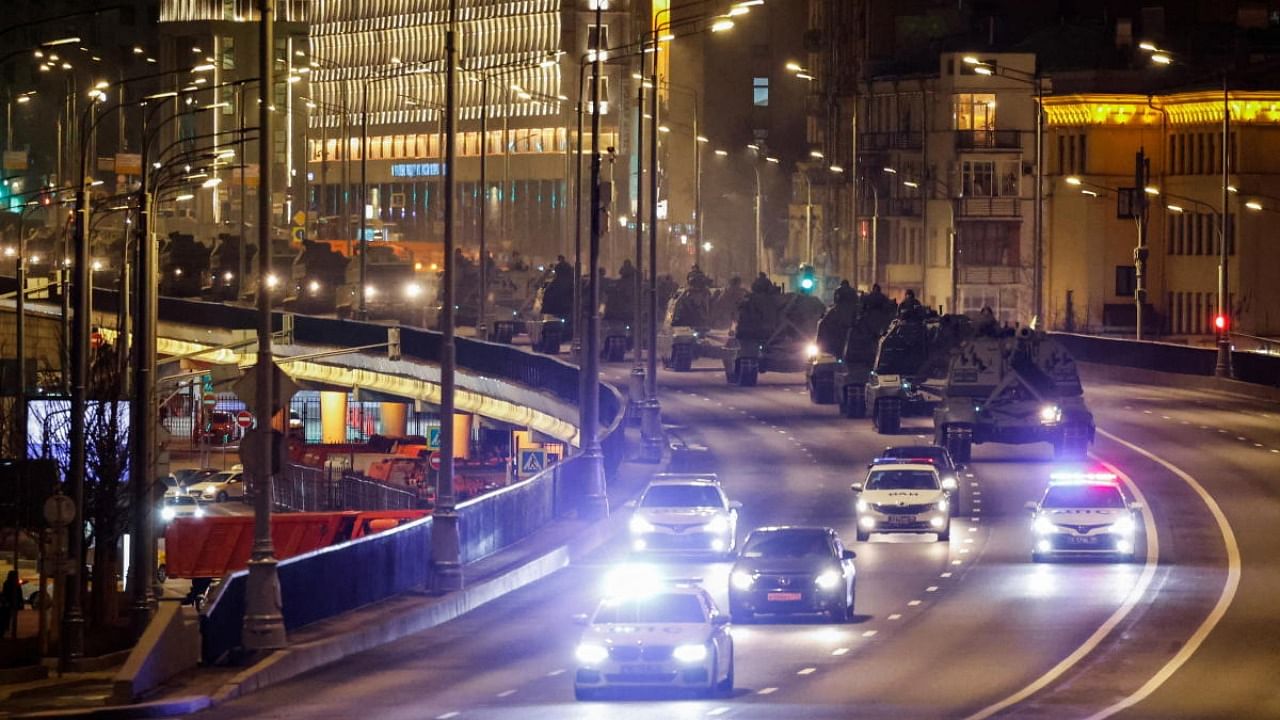 A column of military vehicles drive along a road, as they are relocated for a Victory Day parade preparation in Moscow. Credit: Reuters photo