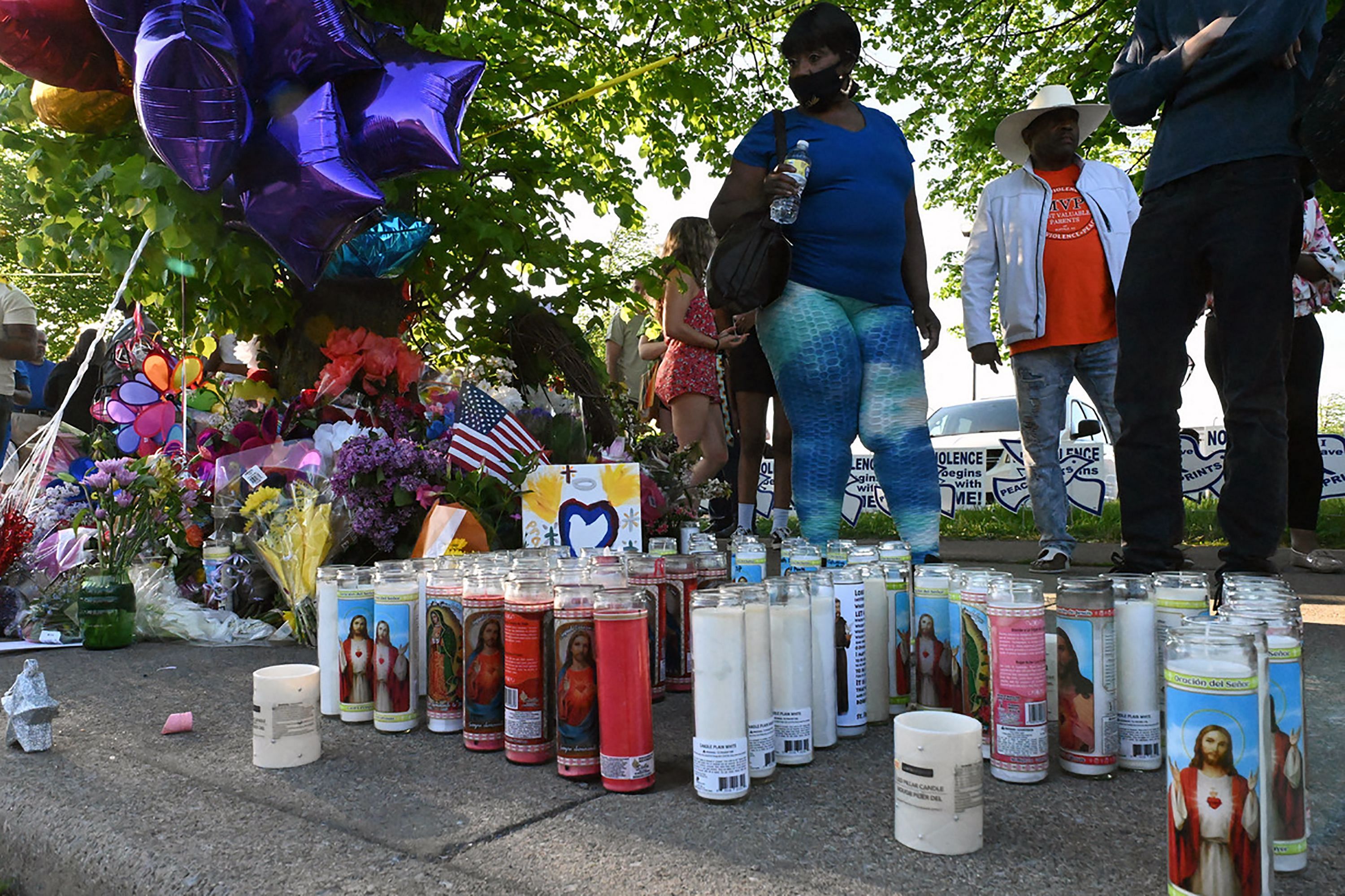 Candles, ballons and flowers are pictured at a makeshift memorial near a Tops Grocery store in Buffalo, New York. Credit: AFP Photo