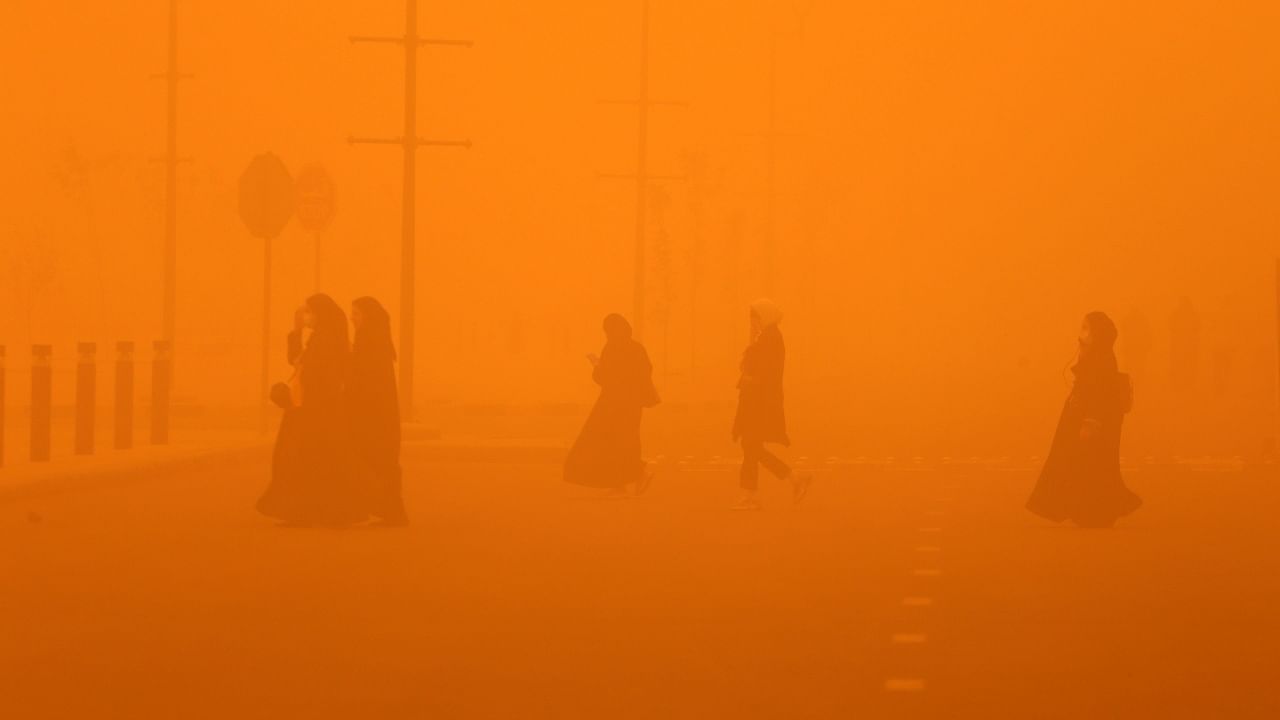 In Pics| Sandstorm shrouds Middle East in orange haze, disrupts normal life. Credit: AFP Photo
