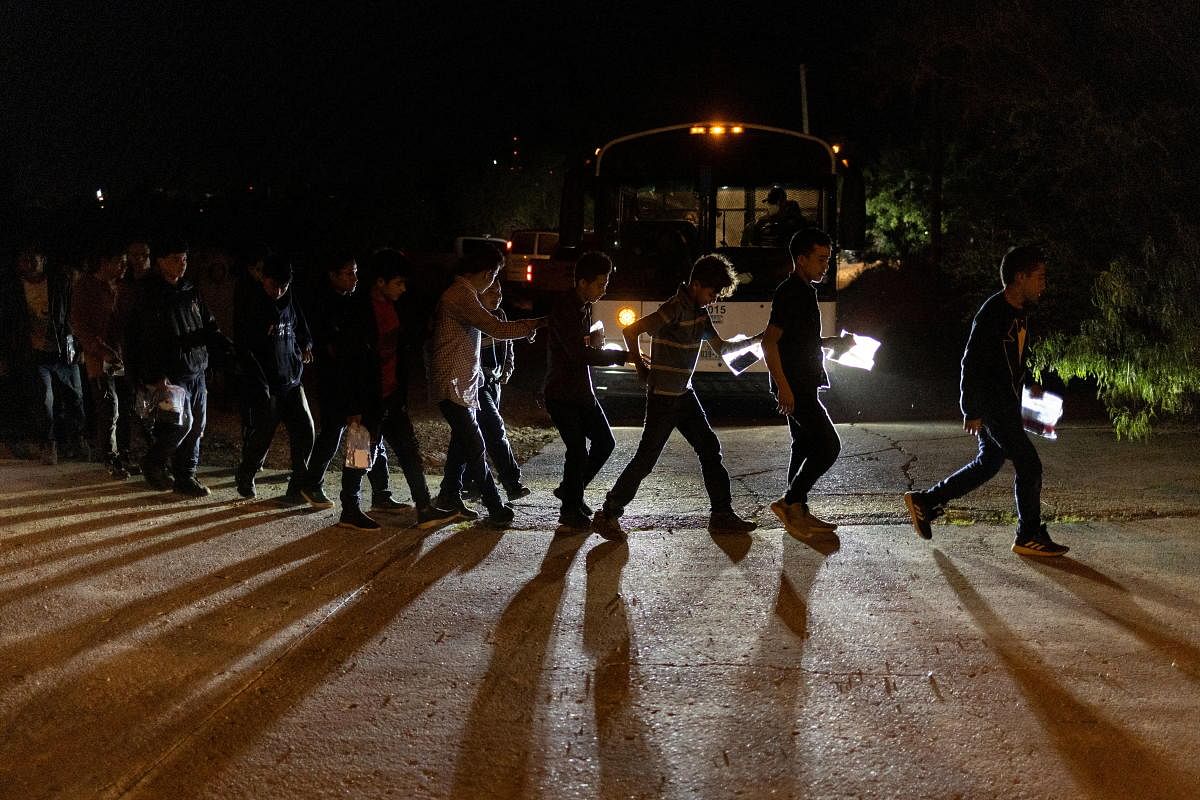 Central American migrant boys under 18 years of age prepare to board a Customs and Border Protection bus after crossing the Rio Grande river into the United States from Mexico in Roma, Texas. Credit: Reuters Photo