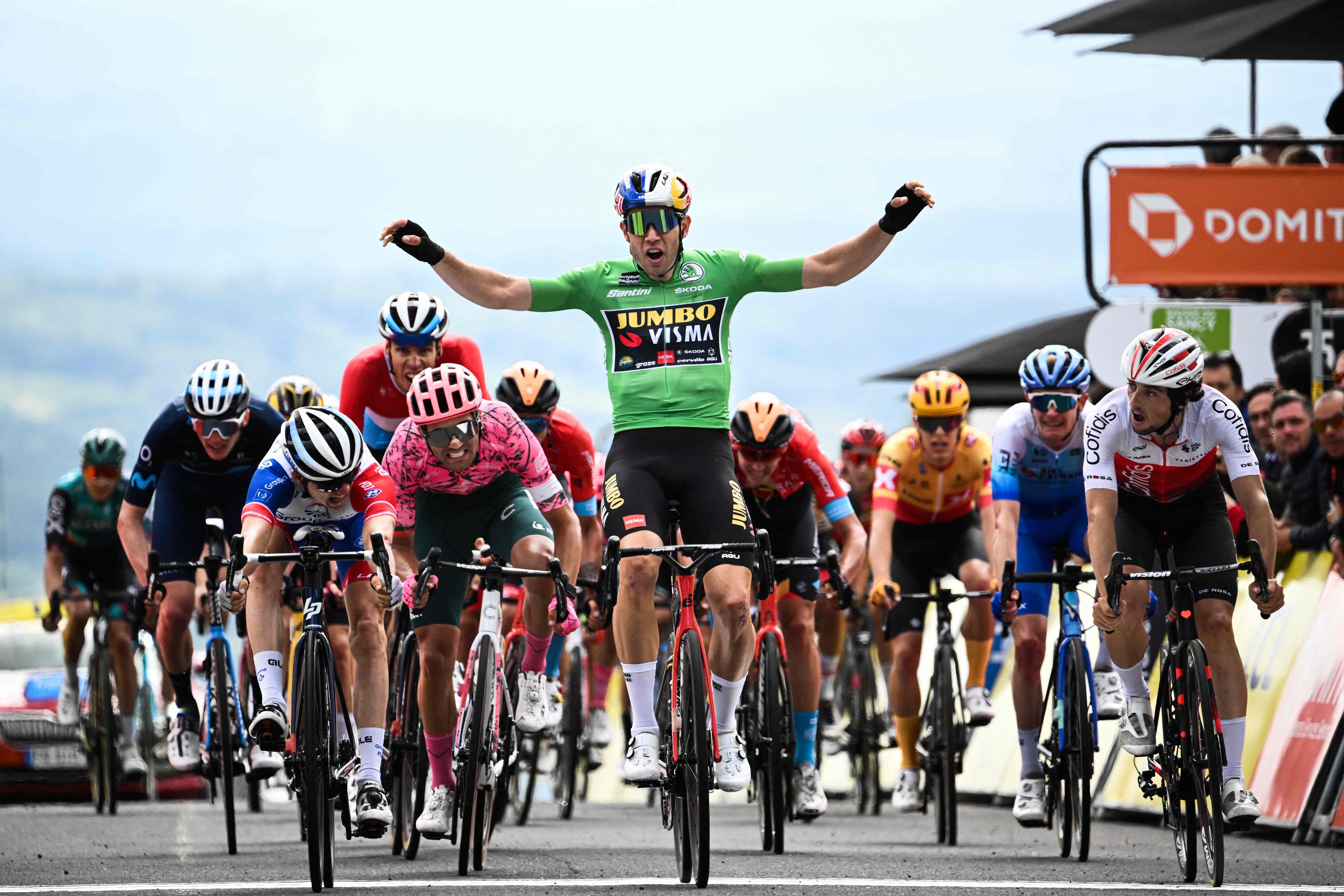 Green jersey of best sprinter Jumbo-Visma team's Belgian rider Wout Van Aert (C) reacts as he crosses the finish line and finishes second next to Groupama-FDJ's French rider David Gaudu. Credit: AFP Photo