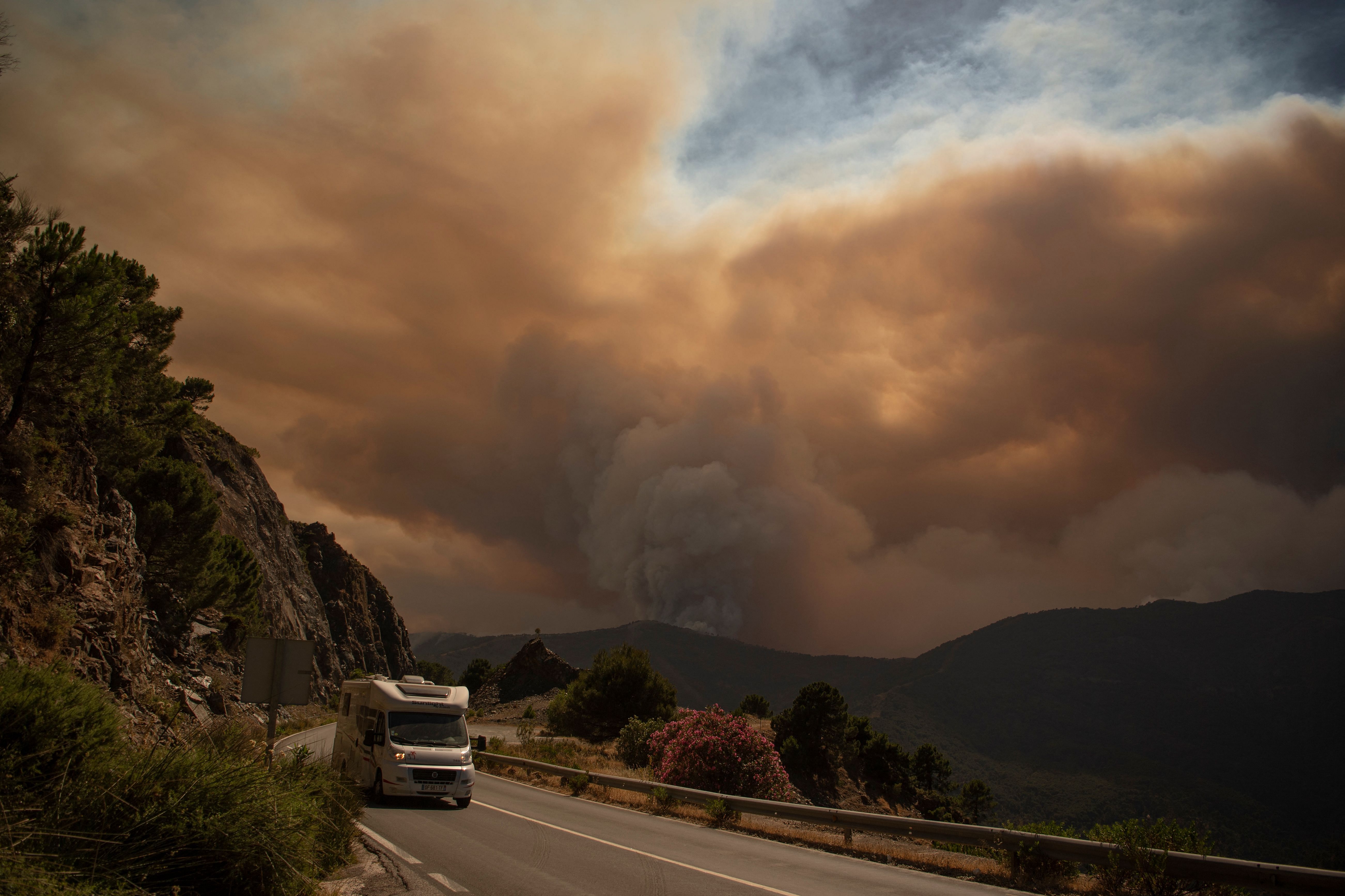 Smoke from a wildfire in Sierra Bermeja mountain range in Malaga is pictured from Benahavis. Credit: AFP Photo