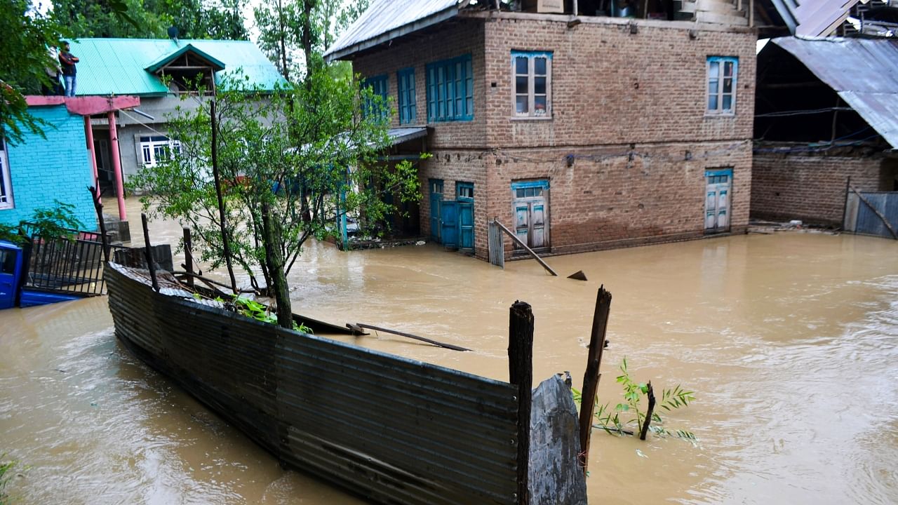 Heavy rains trigger flash floods & landslides in J&K; See Pics Credit: AFP Photo