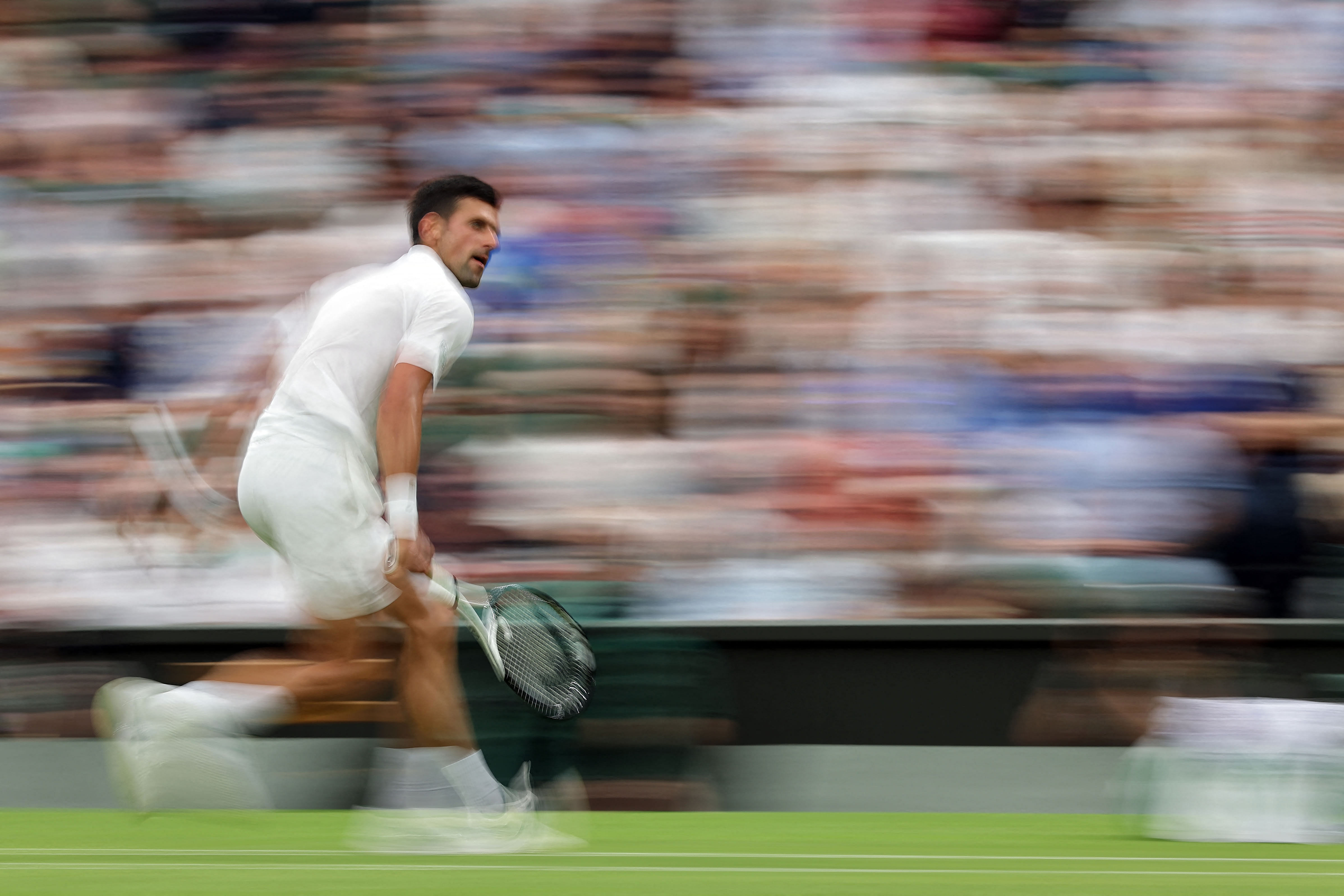 Serbia's Novak Djokovic returns the ball to South Korea's Kwon Soon-woo during their men's singles tennis match on the first day of the 2022 Wimbledon Championships at The All England Tennis Club in Wimbledon, southwest London. Credit: AFP Photo