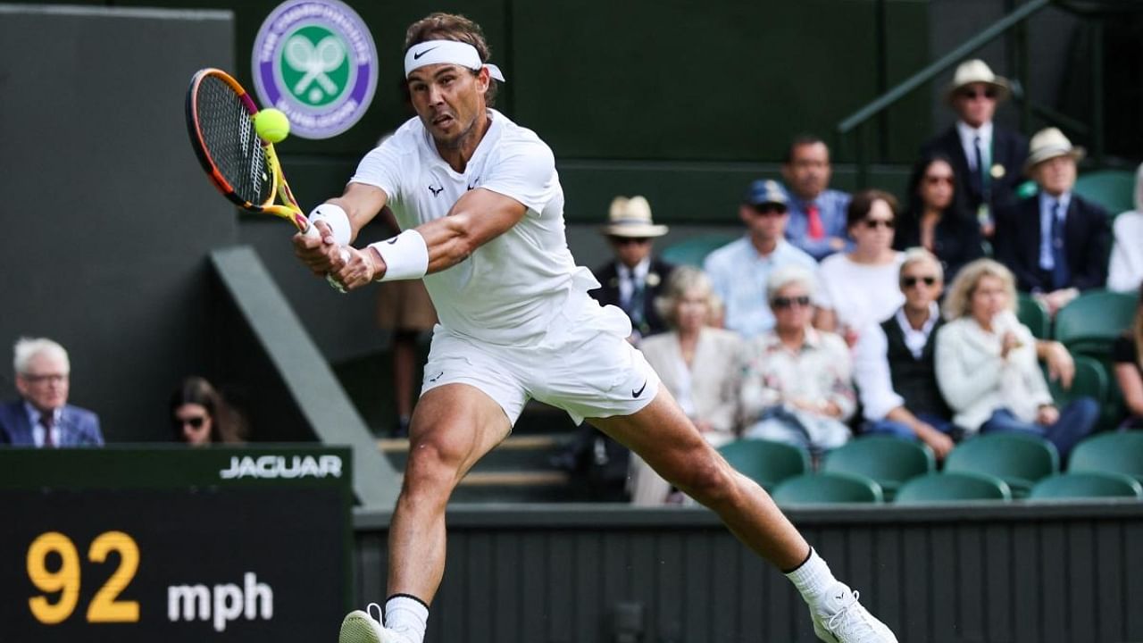 Spain's Rafael Nadal returns the ball to Lithuania's Ricardas Berankis during their men's singles tennis match on the fourth day of the 2022 Wimbledon Championships at The All England Tennis Club in Wimbledon, southwest London, on June 30, 2022. Credit: AFP Photo