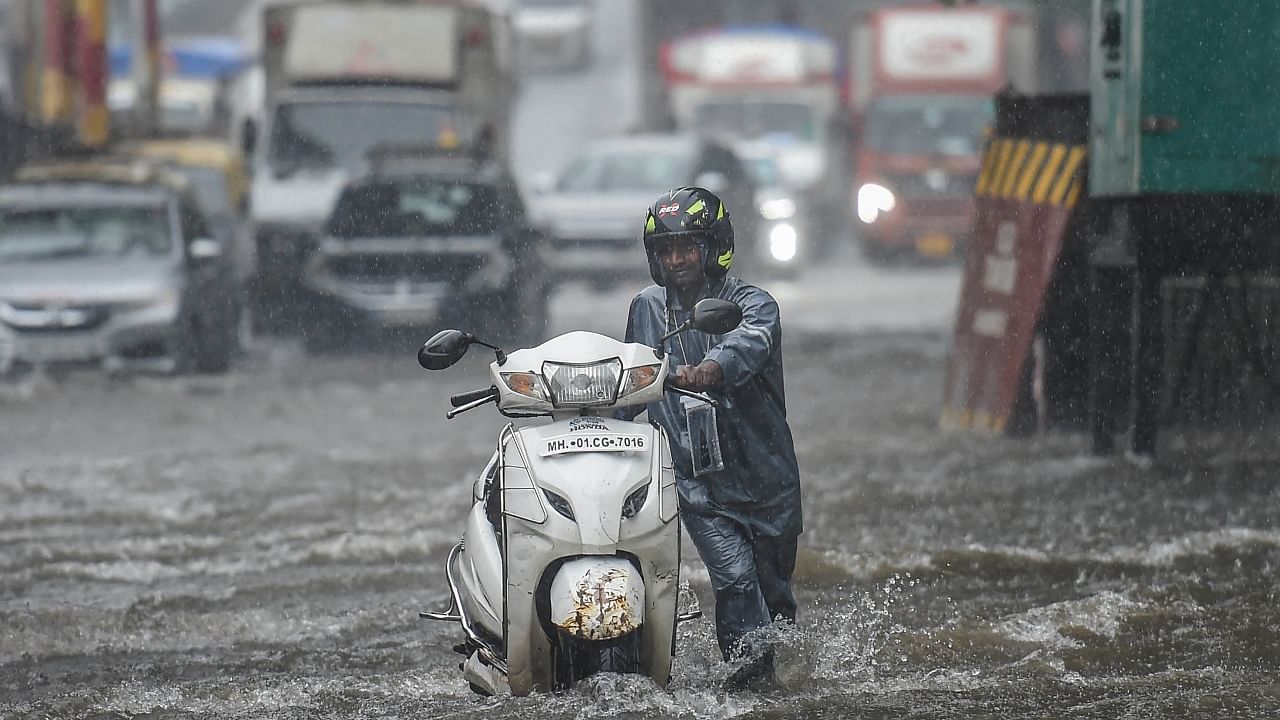 Heavy rains partially submerge Mumbai, daily life affected. Credit: PTI Photo