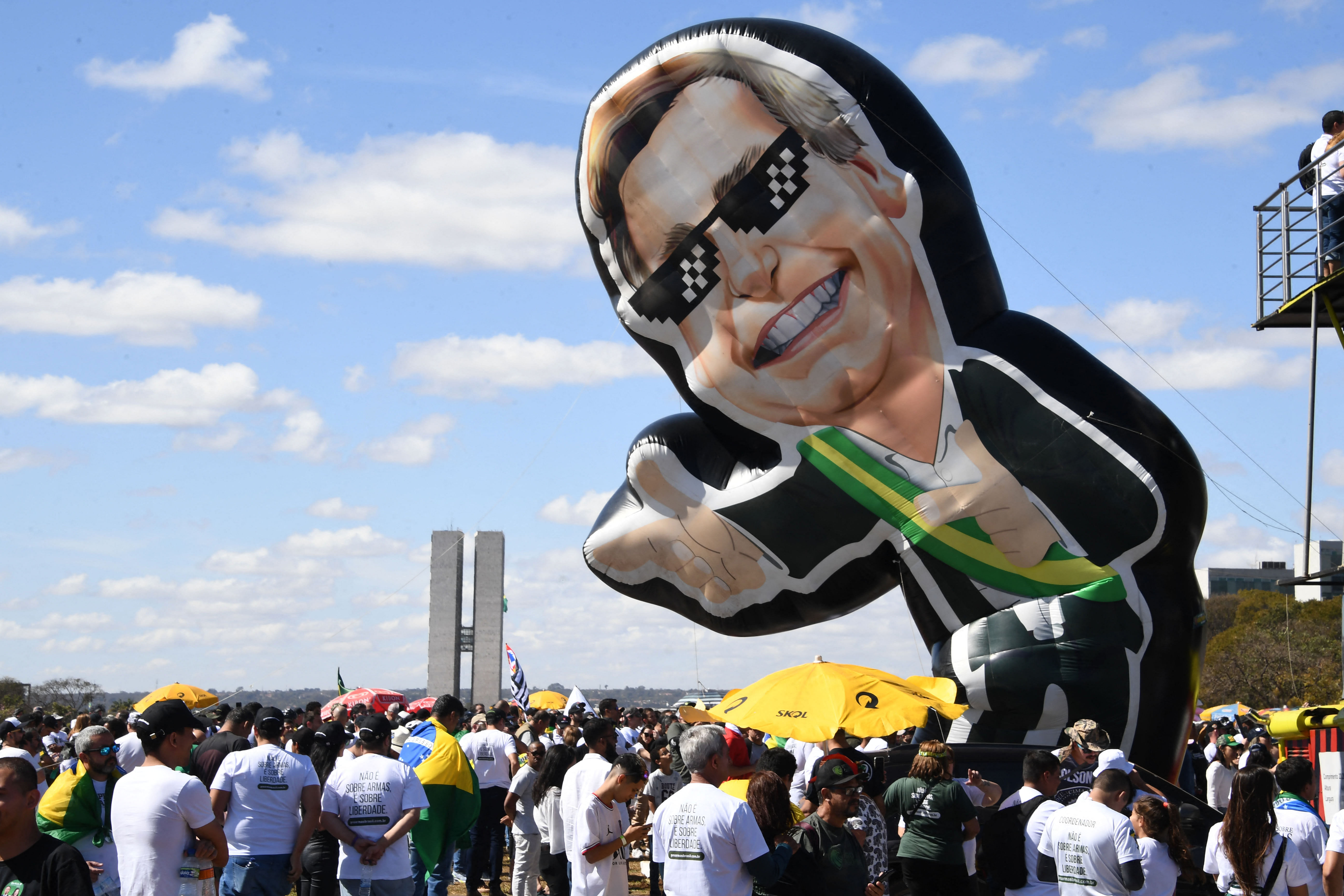 View of an inflatable doll depicting Brazilian President Jair Bolsonaro during a pro-arms demo called by his son, lawmaker Eduardo Bolsonaro, in Brasilia. Credit: AFP Photo
