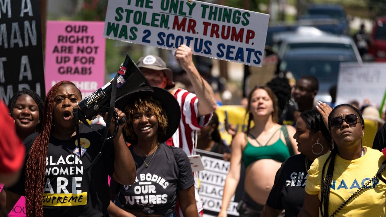 Protestors march and chant in Downtown Atlanta, in opposition to Georgia's new abortion law on July 23, 2022 in Atlanta, Georgia. Credit: AFP photo
