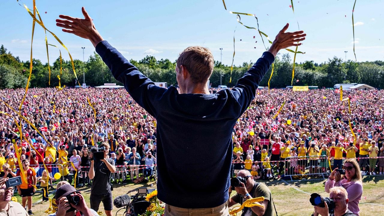 Jumbo-Visma team's Danish rider Jonas Vingegaard, winner of the 2022 Tour de France, is celebrated by fans in his hometown of Glyngore on July 28, 2022, a few days after the finish of the Tour de France cycling race in Paris. Credit: AFP Photo