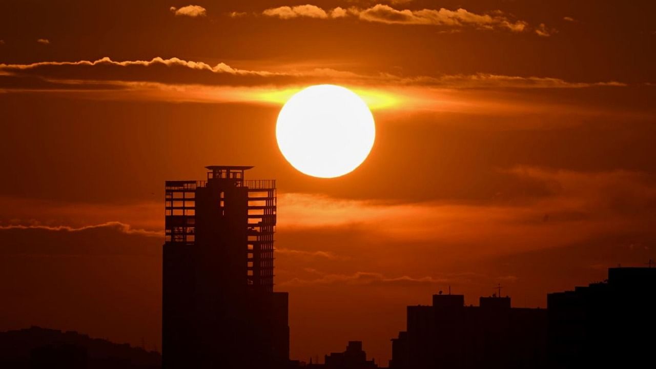The building known as "La torre de David" ("David's tower") is seen during sunset in Caracas. Credit: AFP Photo