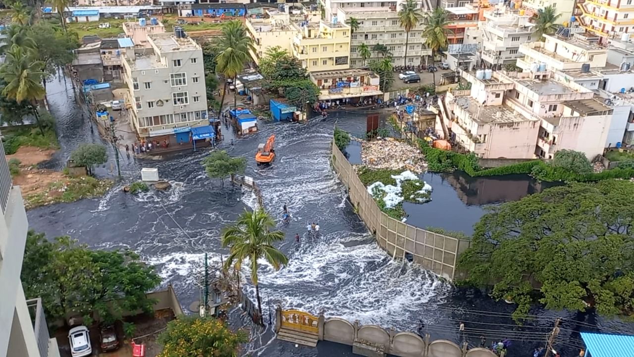 Tractor, boat ride to office as rains drown Bengaluru; See Pics