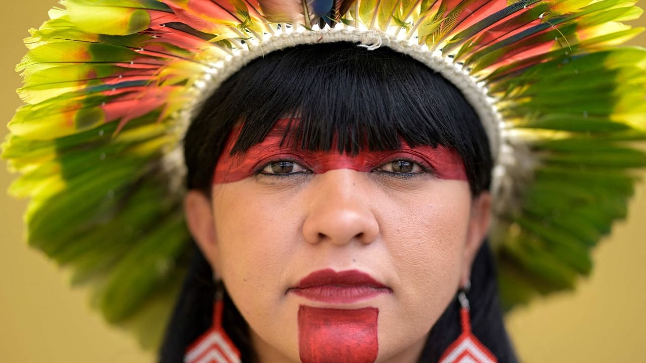 Celia Xakriaba, the first indigenous woman elected Federal Deputy for the state of Minas Gerais, poses for a picture during a meeting with supporters in Contagem, Brazil, on October 23, 2022, ahead of the presidential run-off election. Credit: AFP Photo