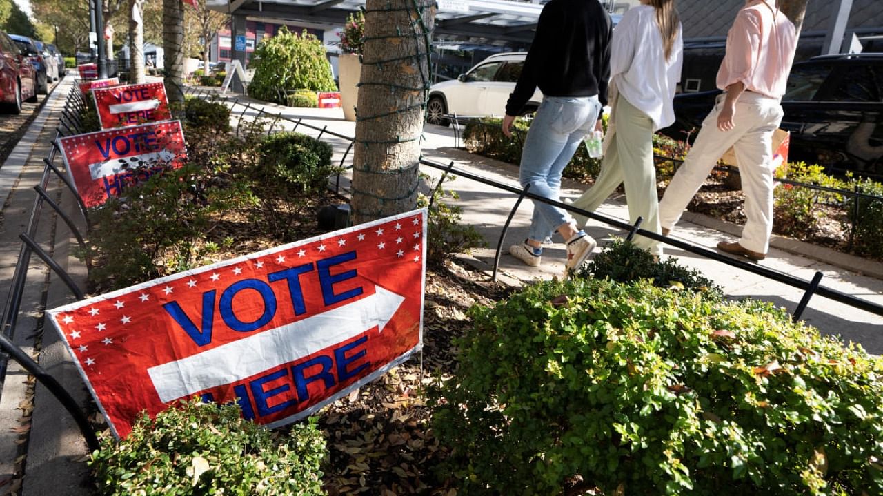 Voting signs for the upcoming midterm election are seen outside a public library and voting station in the Buckhead area of Atlanta, Georgia. Credit: Reuters photo