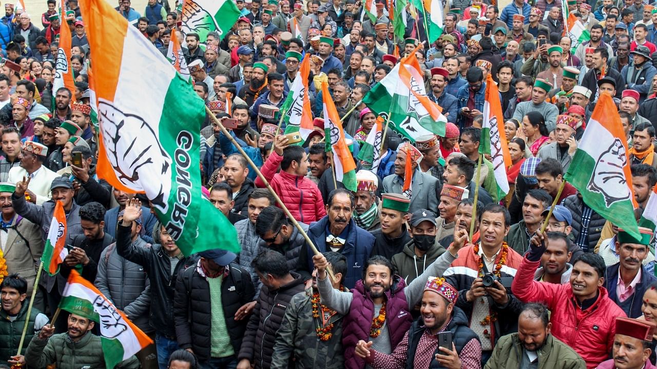 Workers celebrate as Congress sweeps Himachal Pradesh Credit: PTI Photo