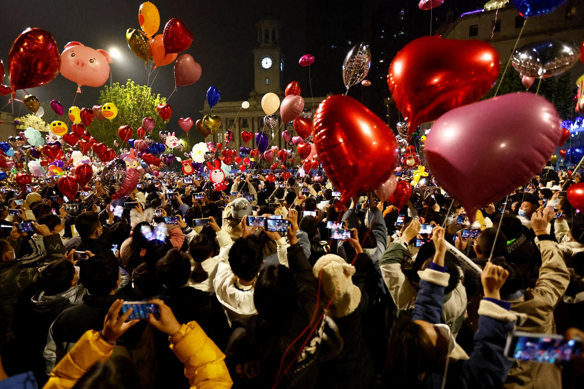 People release balloons as they gather to celebrate New Year's Eve, amid the coronavirus disease (COVID-19) outbreak, in Wuhan, Hubei province, China. Credit: Reuters Photo
