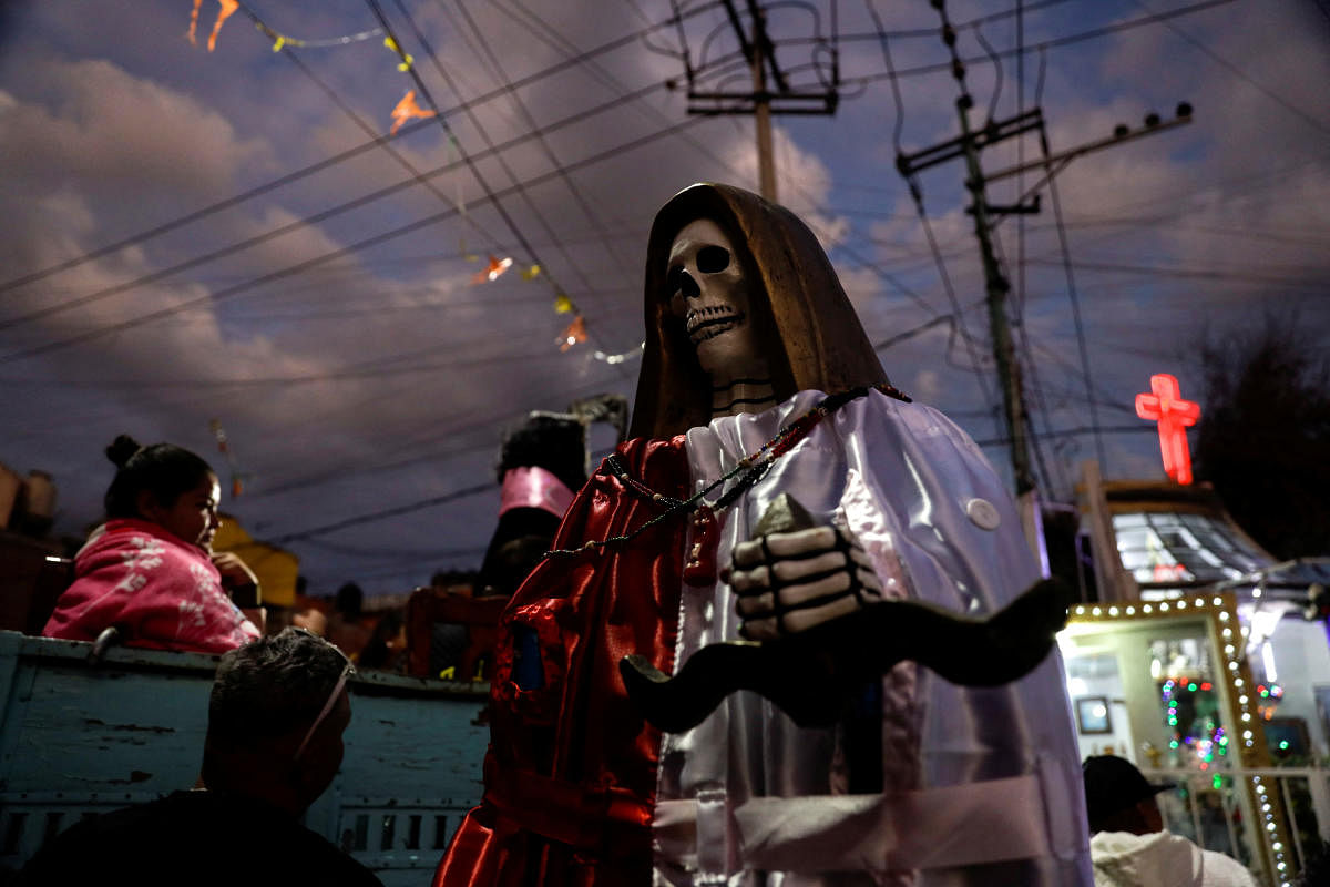 Followers of the Santa Muerte visit her shrine on New Year's day in the Tepito neighbourhood in Mexico City, Mexico. Credit: Reuters Photo