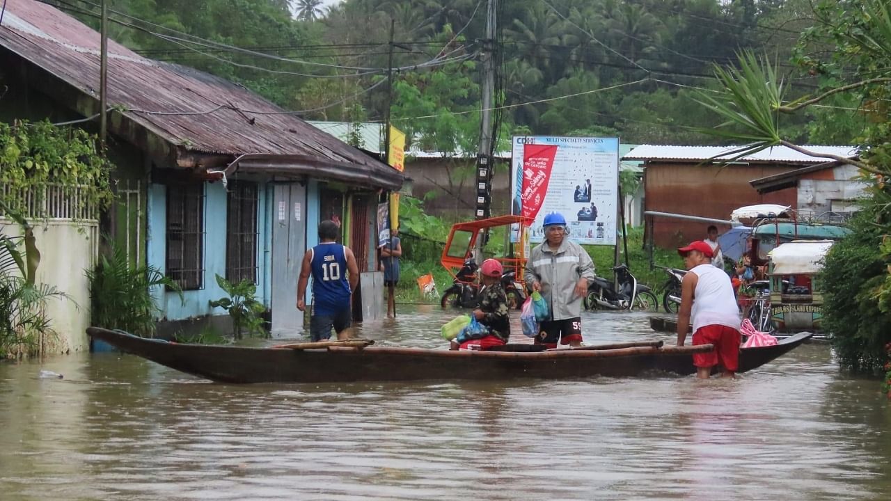 In Pics | 70,000 displaced, 17 killed by floods in Philippines. Credit: AFP Photo
