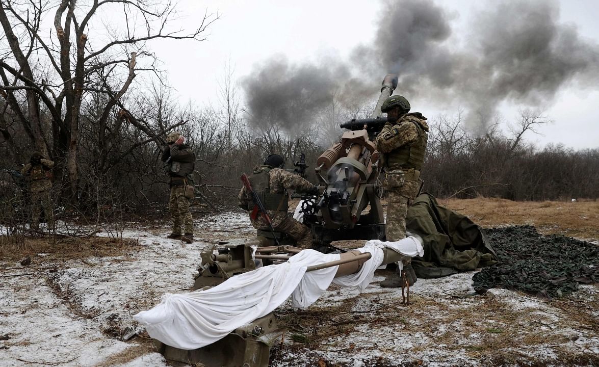 Ukrainian artillerymen fire an L119 howitzer towards Russian positions at a front line in the Lugansk region amid the Russian invasion of Ukraine. Credit: AFP Photo