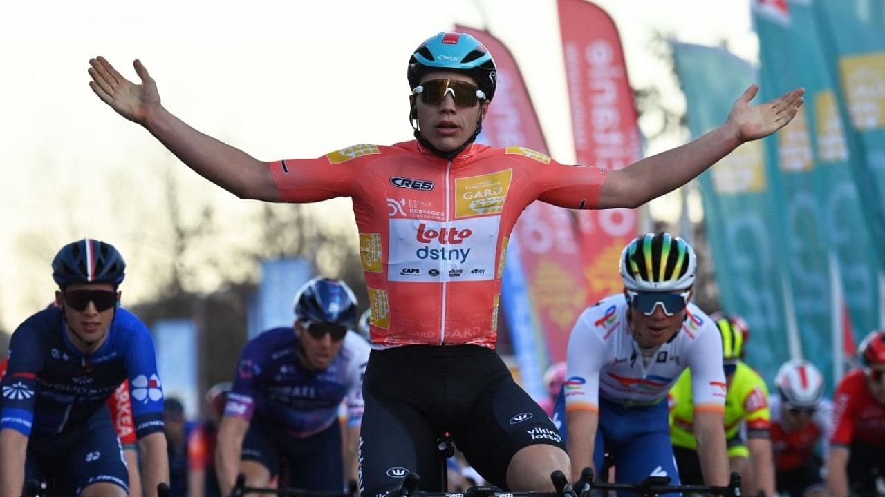 Lotto Dstny Team's Belgian rider Arnaud De Lie celebrates as he wins the third stage of the 53rd Etoile de Besseges-Tour du Gard cycling race between Besseges and Besseges. Credit: AFP Photo