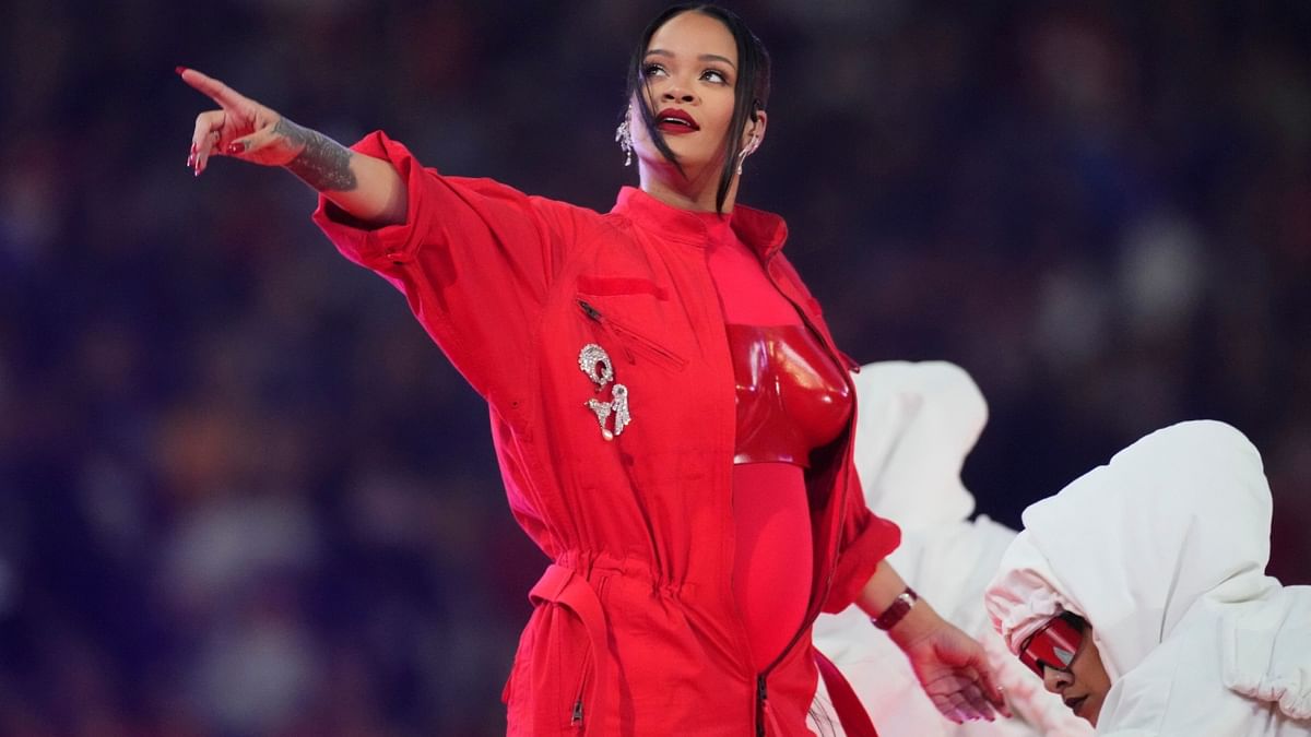 Pregnant Rihanna Cradles Her Baby Bump in Sweet Super Bowl 2023 Photo