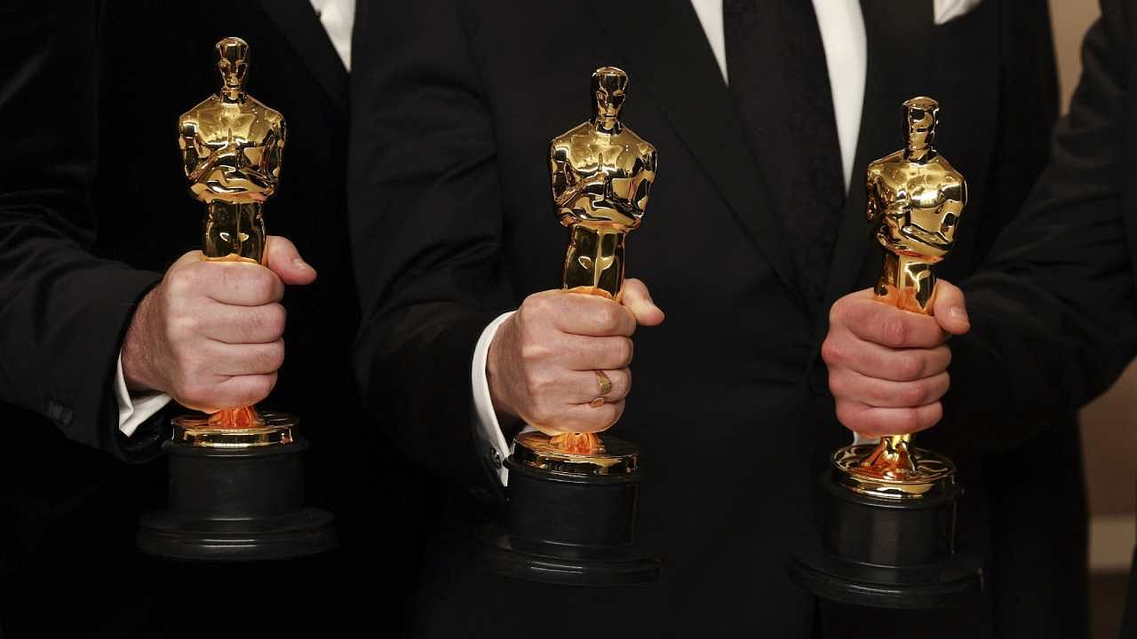 Producers of 'Guillermo del Toro's Pinocchio' pose with their Oscars for Best Animated Feature Film in the Oscars photo room at the 95th Academy Awards in Hollywood, Los Angeles. Credit: Reuters Photo